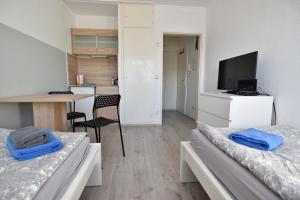 Televisor o centre d'entreteniment de Easy Apartments Work and Stay Cologne 6 fotos més