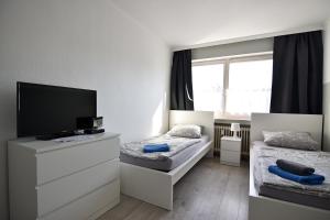 Televisor o centre d'entreteniment de Easy Apartments Work and Stay Cologne
