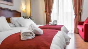 Ein Bett oder Betten in einem Zimmer der Unterkunft Hotel Reina Cristina