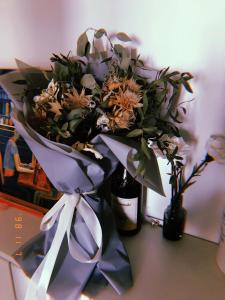 a bouquet of flowers sitting on a table at Zhe·Yi Boutique Guesthouse in Beijing