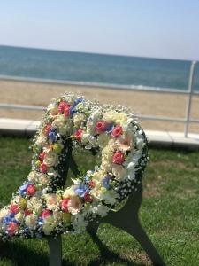 a sculpture of a number with flowers on it at Torre Del Sole in Terracina