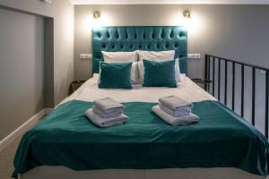 
Кровать или кровати в номере Дизайн Отель Оскар

