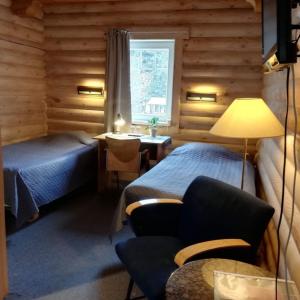 Ένα ή περισσότερα κρεβάτια σε δωμάτιο στο Külalistemaja Vehendi Motell