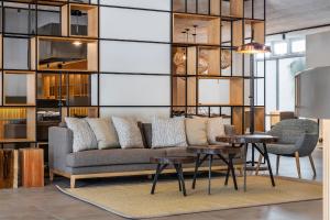 a living room with a couch and a table at The Patio Suite Hotel in Albufeira