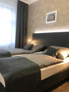 Postel nebo postele na pokoji v ubytování Penzion Ema B&B