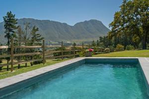The swimming pool at or close to High Season Farm Luxury Cottages