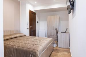 Televízia a/alebo spoločenská miestnosť v ubytovaní Casa Vacanze del Corso + 37 fotografií