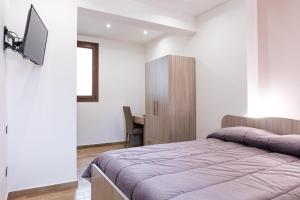 Televízia a/alebo spoločenská miestnosť v ubytovaní Casa Vacanze del Corso