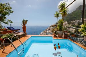 a swimming pool with a view of the ocean at Villa Fiorentino in Positano