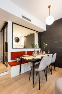 a dining room with a table and chairs at CMG Jacques /Pantheon in Paris