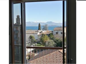 a view from a window of a city at Guido's Apartment Villa Romana in Desenzano del Garda