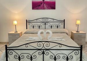 A bed or beds in a room at HOME SALENTO