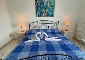 A bed or beds in a room at HOME SALENTO