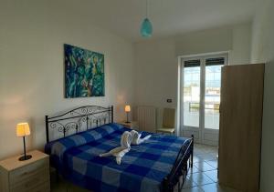 A bed or beds in a room at HOME SALENTO