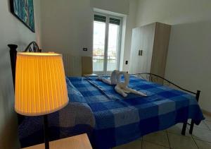A bed or beds in a room at HOME SALENTO