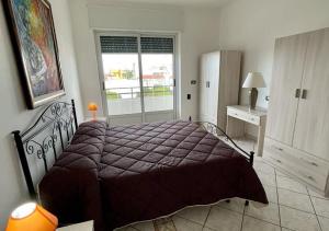 A bed or beds in a room at HOME SALENTO