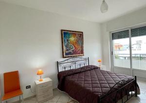 A bed or beds in a room at HOME SALENTO