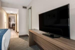 a hotel room with a large flat screen tv at Comfort Inn & Suites Downtown Brickell-Port of Miami in Miami