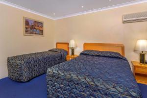 Ein Bett oder Betten in einem Zimmer der Unterkunft Comfort Inn Bay of Isles