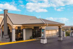 a rendering of the front of a building at Quality Inn Branson On the Strip in Branson