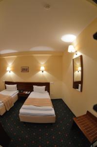 En eller flere senge i et værelse på Coroana Brasovului