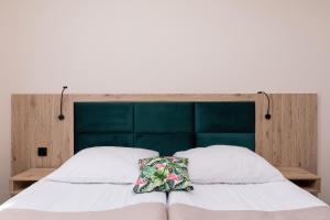 Postel nebo postele na pokoji v ubytování Flamingo