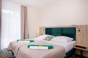Postel nebo postele na pokoji v ubytování Flamingo