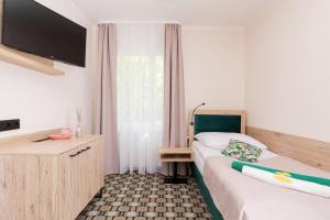 Postel nebo postele na pokoji v ubytování Flamingo