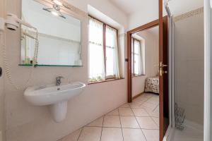 a bathroom with a sink and a mirror at Locanda Le Palafitte in Bardolino +36 photos