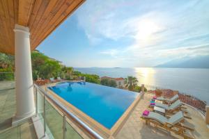 a pool on the balcony of a villa at Villa Poseidon-in winter heated outdoor pool in Kas