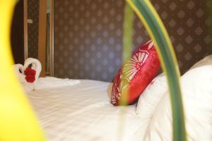 Postel nebo postele na pokoji v ubytování Hotel Balik Pulau
