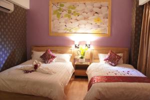 Postel nebo postele na pokoji v ubytování Hotel Balik Pulau