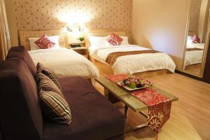 Postel nebo postele na pokoji v ubytování Hotel Balik Pulau