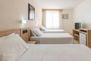 Hotel Açores客房内的一张或多张床位