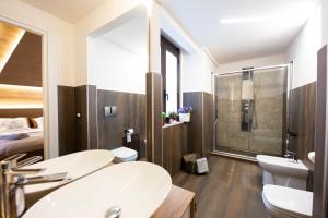 a bathroom with two sinks and a shower at Etna Hills in Catania