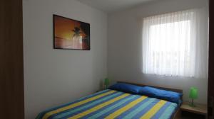 Postel nebo postele na pokoji v ubytování Apartments Vabec