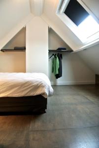 Un pat sau paturi într-o cameră la De Heerlykheid