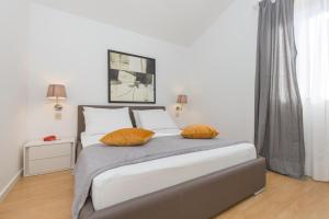 Postel nebo postele na pokoji v ubytování Apartments Agava Romantic