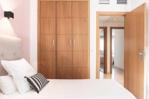Posteľ alebo postele v izbe v ubytovaní Pacificio Beachfront