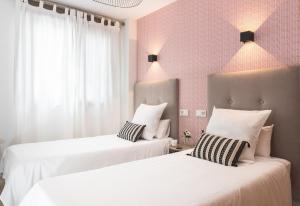 Posteľ alebo postele v izbe v ubytovaní Pacificio Beachfront