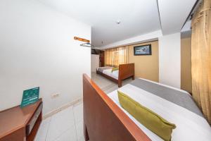 TV a/nebo společenská místnost v ubytování Hotel Home Bioma 1010