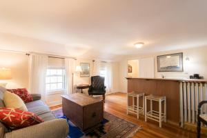 a living room with a couch and a table at Marshall Slocum Inn in Newport