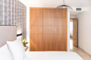 Posteľ alebo postele v izbe v ubytovaní Pacificio Beachfront