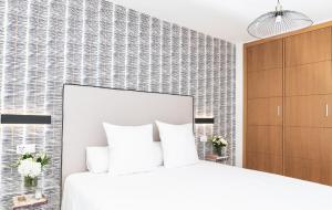 Posteľ alebo postele v izbe v ubytovaní Pacificio Beachfront