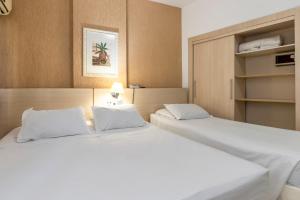 Postel nebo postele na pokoji v ubytování Hotel Ilha da Madeira
