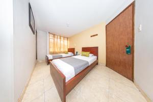 Postel nebo postele na pokoji v ubytování Hotel Home Bioma 1010