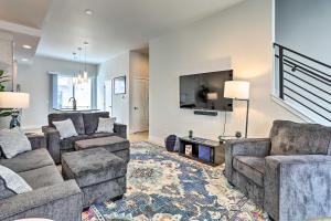a living room with two couches and a tv at Trendy Denver Townhome - Walk to Mile High Stadium in Denver