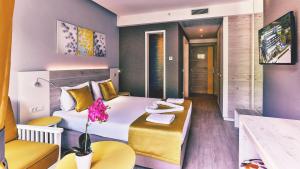 Postel nebo postele na pokoji v ubytování Carine Hotel Park