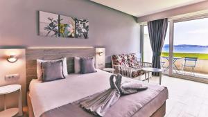 Postel nebo postele na pokoji v ubytování Carine Hotel Park