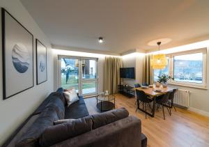 Televízia a/alebo spoločenská miestnosť v ubytovaní Apartament A7